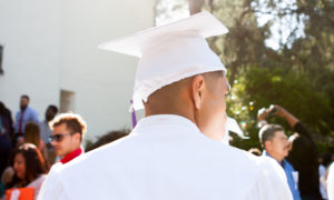 Graduate looking off into the distance to the right